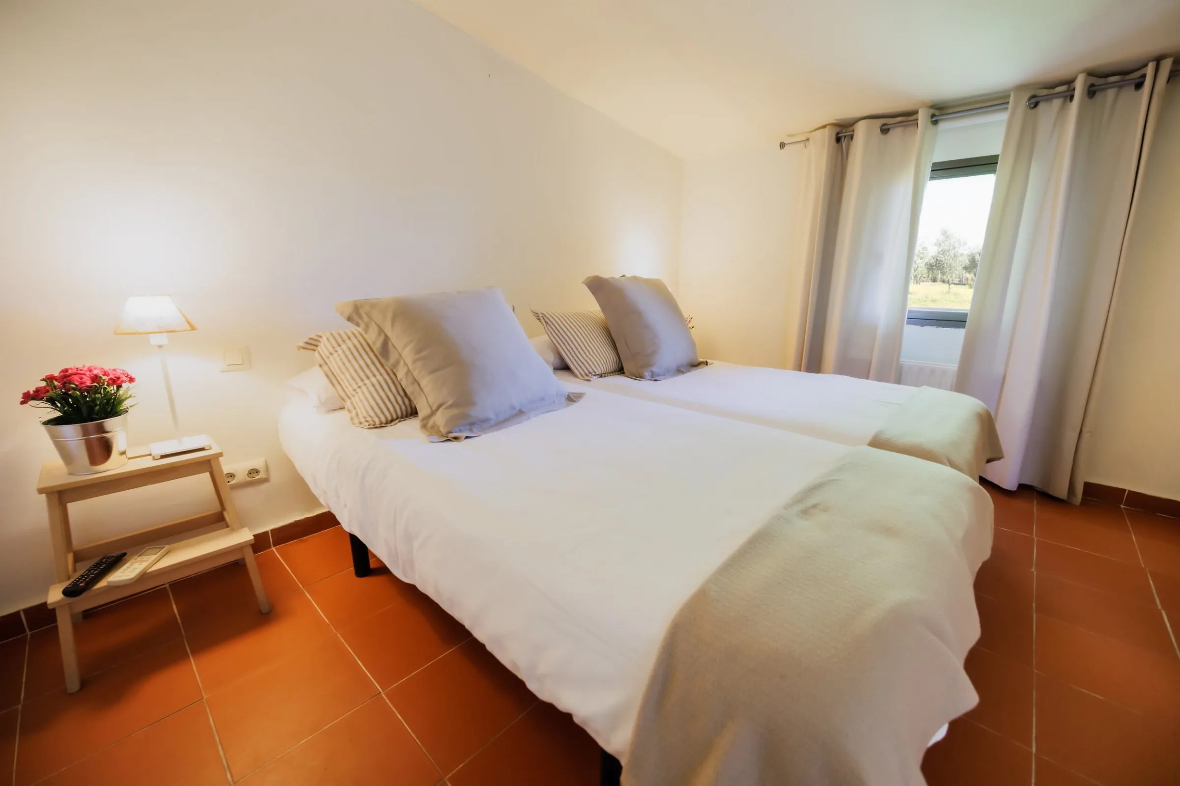 Bedroom with two beds and an en-suite bathroom